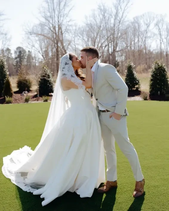 Photo of the model wearing a white bridal gown