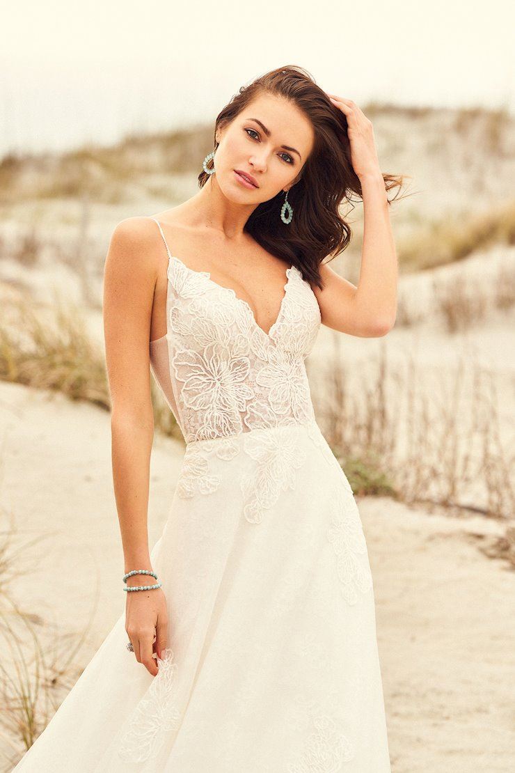 Model wearing a Lillian West gown